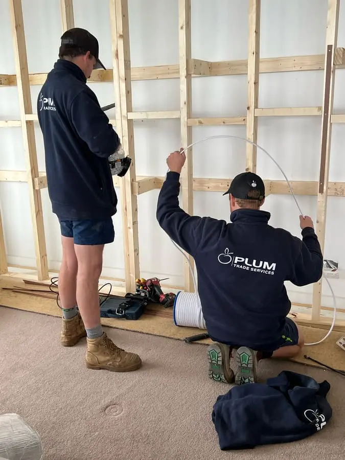 Plum electrician carrying out a residential installation