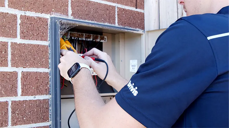 Plum electrician checking a switchboard for faults