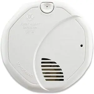 Hard-wired smoke detector installed in a rental property